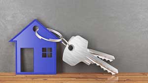a set of keys with a house-shaped keychain