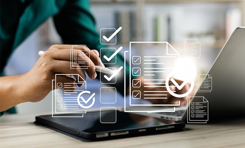 Close up person using laptop with overlay illustration of checklist