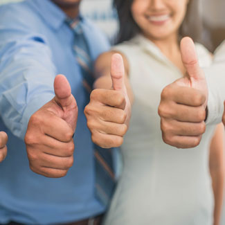 three people with their thumbs pointed up
