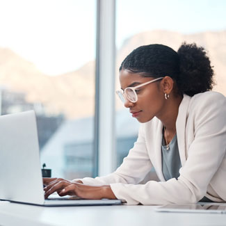 A woman typing on a computer