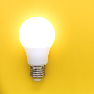 a lightbulb on a yellow background