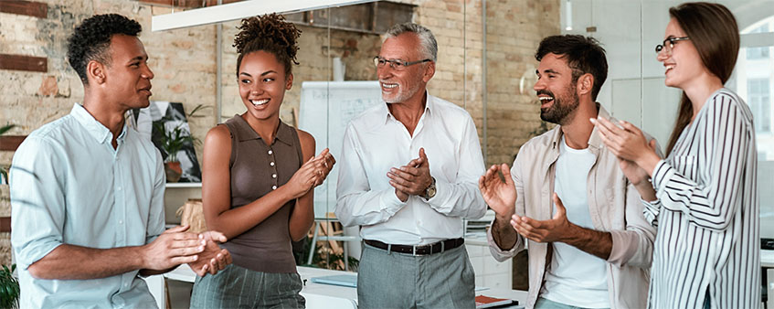 Group of people clapping in joy