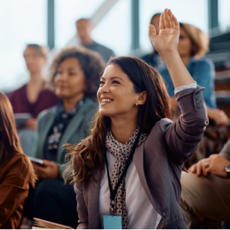 Woman raising hand at drop-in session