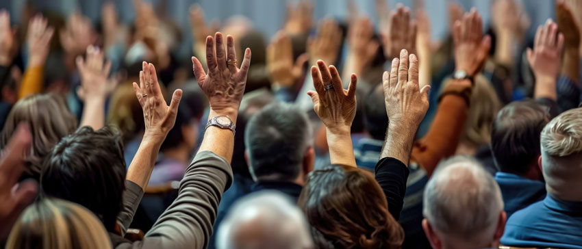 Crowd of people with raised hands
