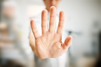 Hand up indicating stop