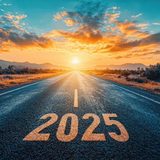 The year '2025' is printed on a road leading to a sunset