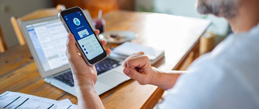 Close up of person looking at account information on phone