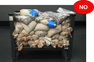 Incorrect canvas bags with lables facing inwards and some bags showing evidence of holes and tears.