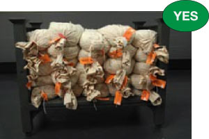 Correct coin bags stacked on pallet with labels facing out
