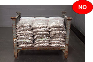 Coin bags stacked on pallet improperly, with labels facing inward