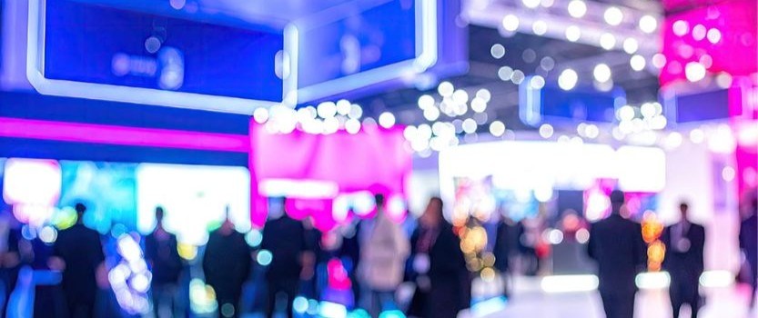 out of focus photo of conference exhibit hall