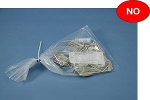 Incorrect example of currency bag with loose notes