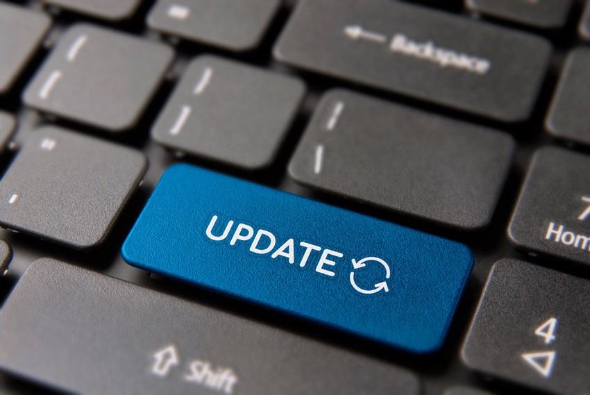 a close-up of an 'update' key on a keybord