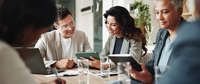 Group of business people talking at table
