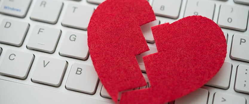 Broken felt heart on top of a keyboard